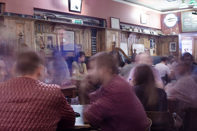 Picture of blurry people sitting in a pub